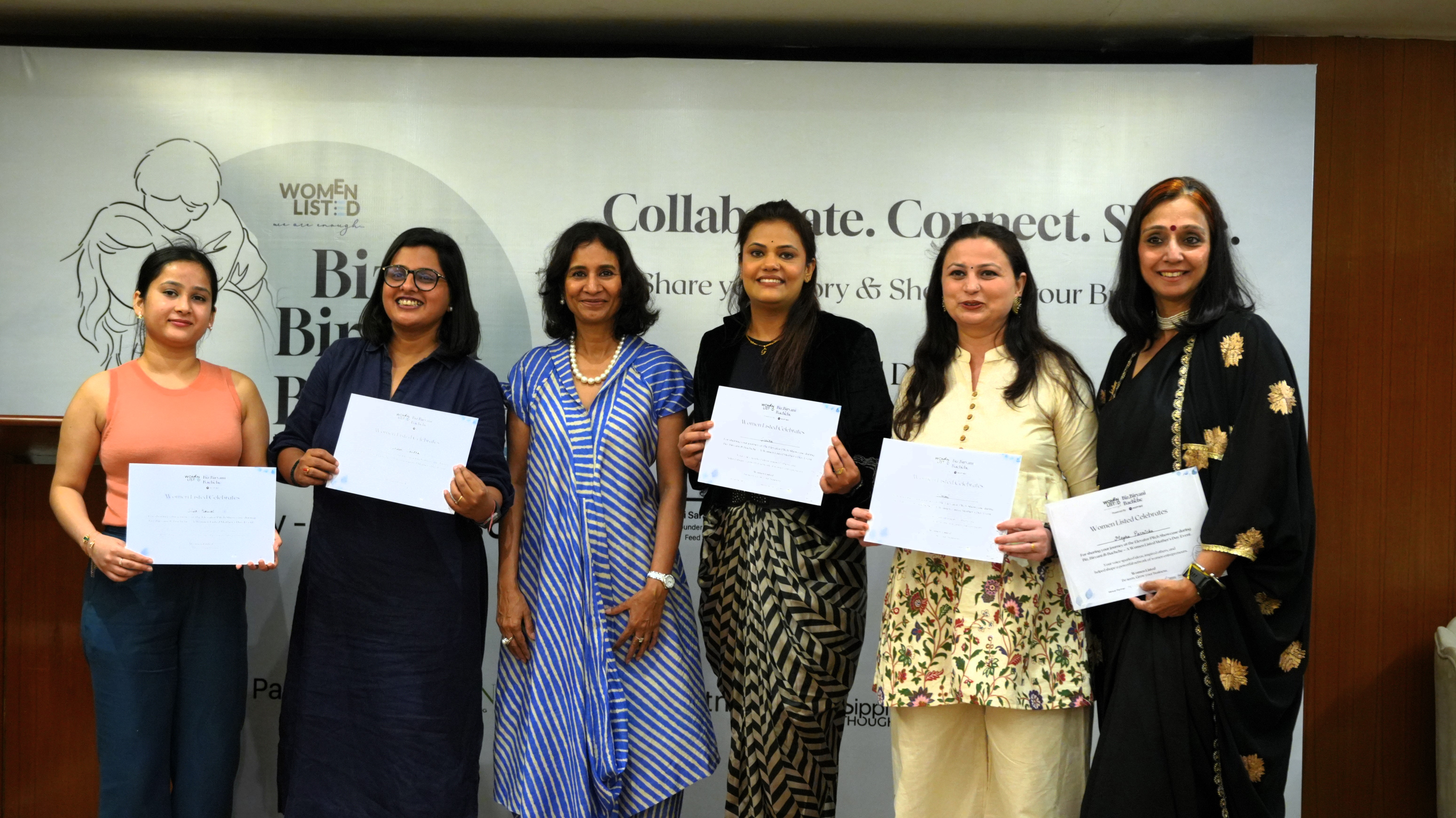Two young happy attractive women business partners using at laptop at meeting in cafe
